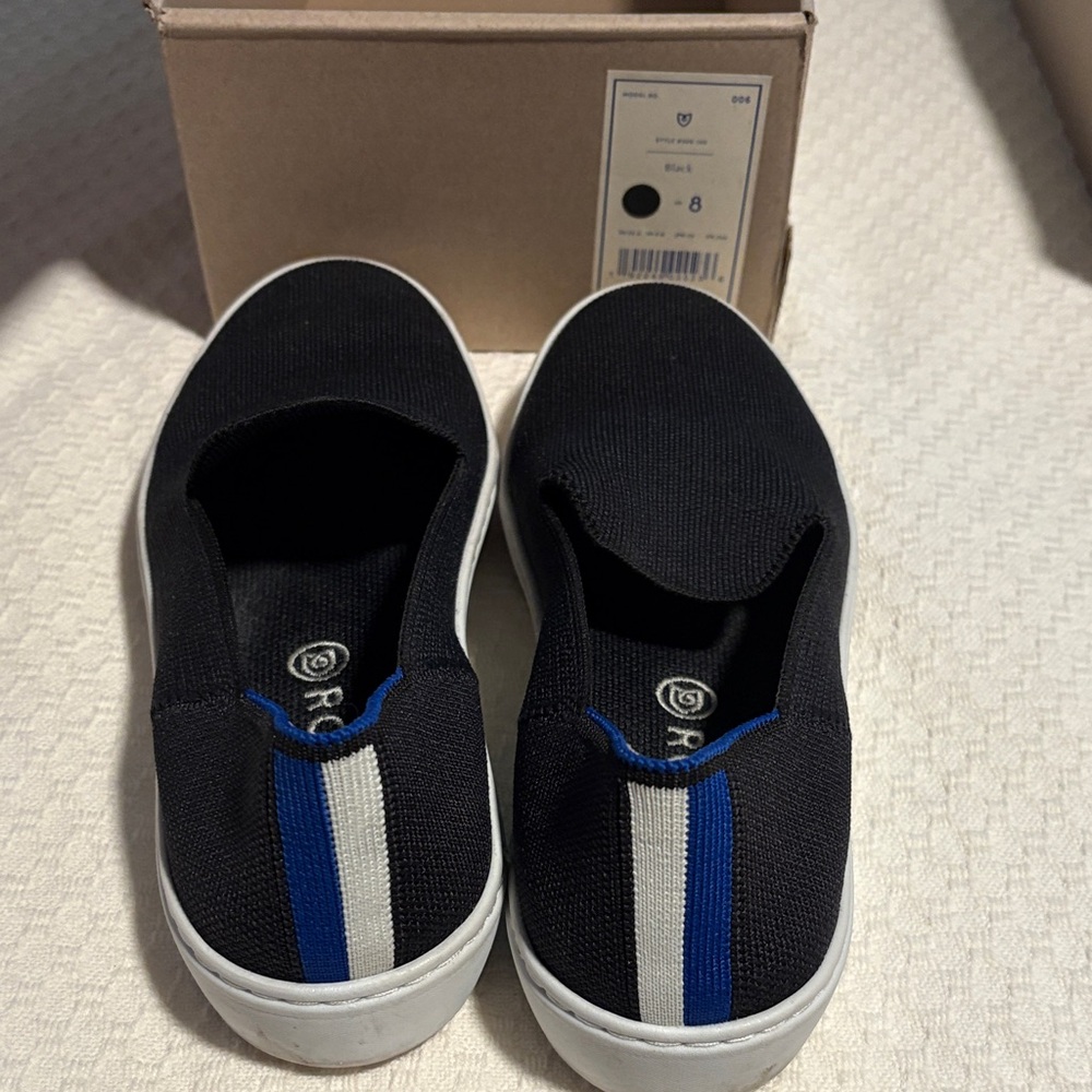 Rothy's Black Slip-On Sneakers with Blue and White Detail